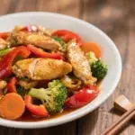 low-carb chicken and veggie stir-fry on cauliflower