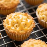 Golden baked mac and cheese muffins with crispy panko topping