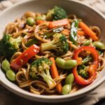 Vegetarian stir-fry noodles with broccoli, carrots, and tamari sauce