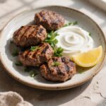 Beef Kofta with Greek Yogurt Sauce on a plate