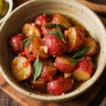 No-Mayo Potato Salad with Herbs in rustic bowl with fresh herbs